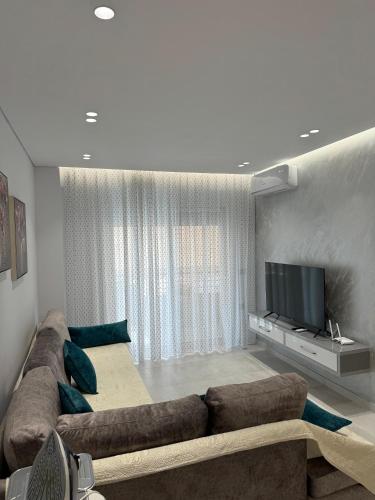 โทรทัศน์และ/หรือระบบความบันเทิงของ Alpha Lux Apartment