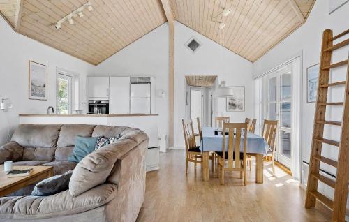 a living room with a couch and a table at Amazing Home In Nordborg With Wifi in Nordborg