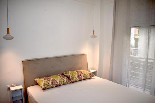 Postel nebo postele na pokoji v ubytování Jasmine Apartment