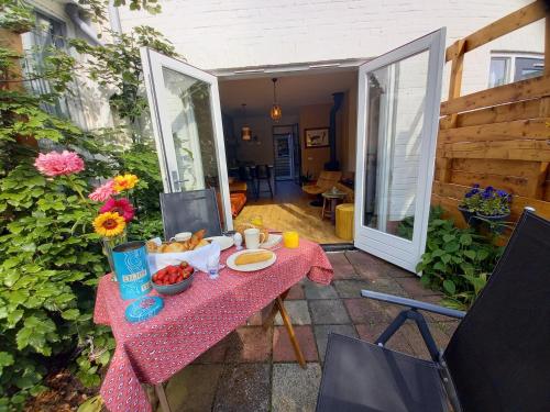 a table with food on it on a patio at Petitville in Austerlitz