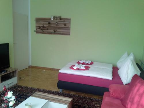 a living room with a bed and a couch at Ferienwohnung Burgblick in Kapfenberg