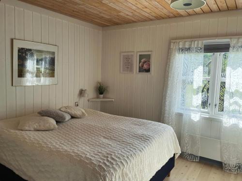 Postel nebo postele na pokoji v ubytování Charmerende sommerhus - 200 m fra stranden