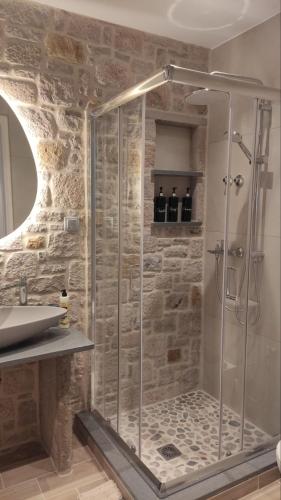 a bathroom with a shower and a sink at Gea luxury apartment Myrina 1 in Myrina
