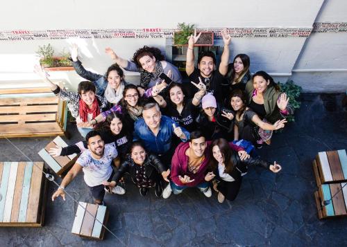 a group of people posing for a picture at Play Hostel Arcos in Buenos Aires