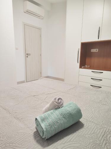 a room with a bed with a towel on it at Antoni Apartment in Lastovo