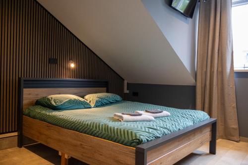 Postel nebo postele na pokoji v ubytování Zeeschelp - Comfortabele kamer bij B&B Gezond aan Zee - Toegang Wellnesstuin meerprijs