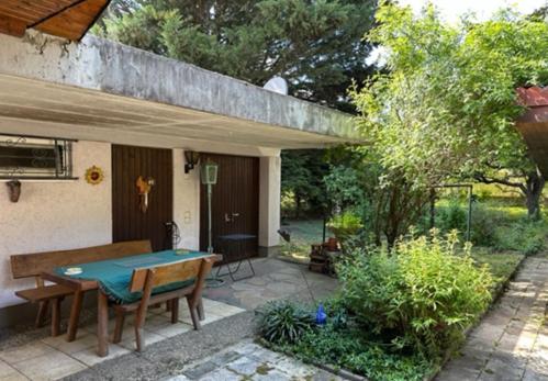 a patio with a ping pong table in a backyard at Haus Anneliese in Herbolzheim