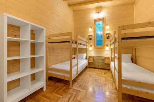a room with two bunk beds and a window at Montebelo Villas in Veliko Tŭrnovo