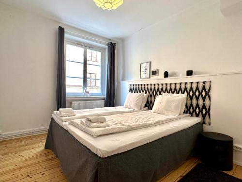 Postel nebo postele na pokoji v ubytování Stay Inn Söder Cozy apartment