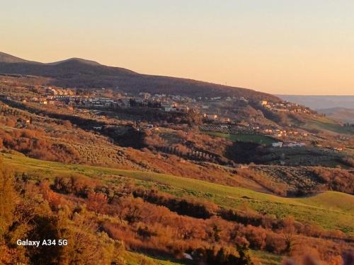 a view of a valley with a town on a hill at Il Doganiere in Montecchio