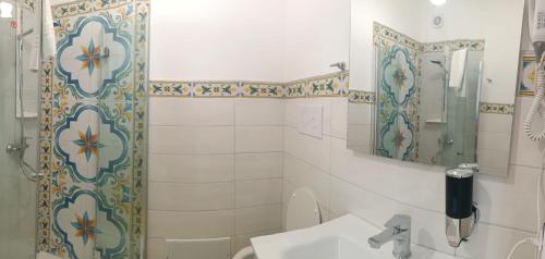 a bathroom with a shower and a sink at Cristalli di Keli in Santa Elisabetta