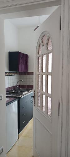 an open door to a kitchen with a window at Cristalli di Keli in Santa Elisabetta