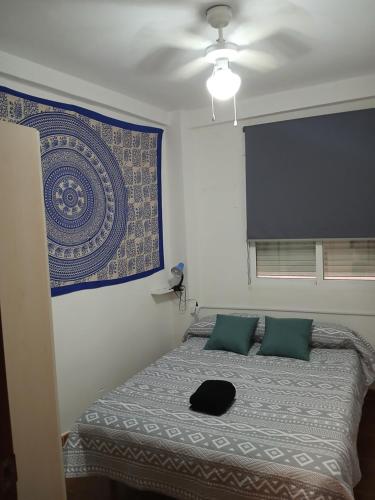 En eller flere senge i et værelse på Comfort Apartamento Compartido