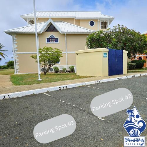 a house with two parking signs in front of it at 21 Plantations Paradise in Lowlands
