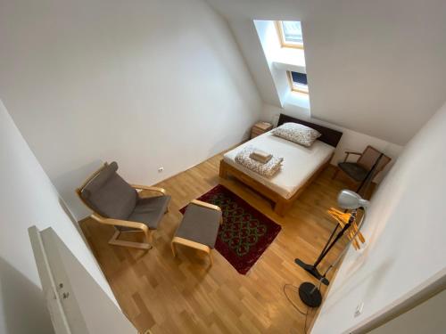 an overhead view of a bedroom with a bed and a desk at Luxury Penthouse near Metro, Train Station and 15 mins Center in Vienna