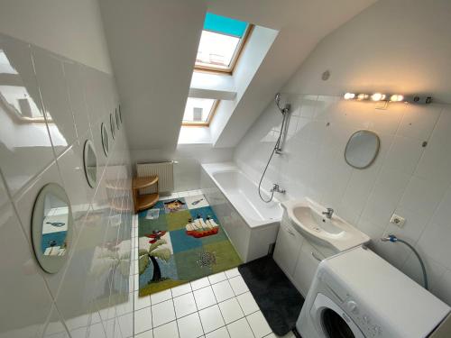 a bathroom with a white toilet and a sink at Luxury Penthouse near Metro, Train Station and 15 mins Center in Vienna