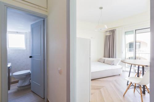 a living room with a couch and a table at Theo Apartment Rethymno in Rethymno