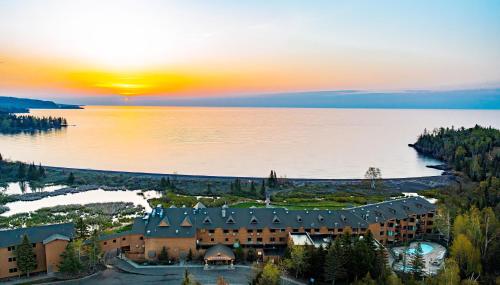 an aerial view of a resort on a lake at sunset at Superior Shores Resort in Two Harbors