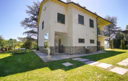 a large white house with a yard in front of it at Cozy Home In Marsaglia With Kitchen in Marsaglia
