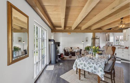 a dining room with a table and a living room at Cozy Home In Warendorf With Wifi in Warendorf