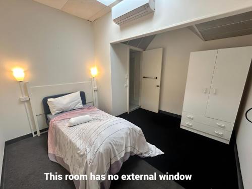 Postel nebo postele na pokoji v ubytování Studio 5 - Wright Lodge