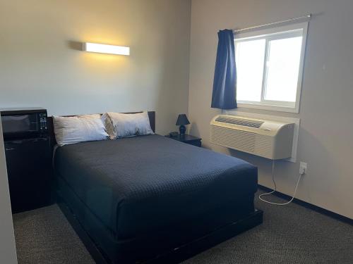 Postel nebo postele na pokoji v ubytování Come on Inn Motel