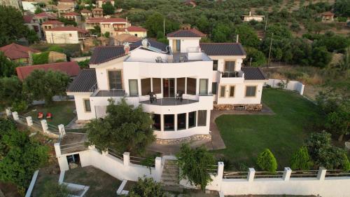 an aerial view of a large white house at Zografos Studios Zacharo Zakharo in Zakharo