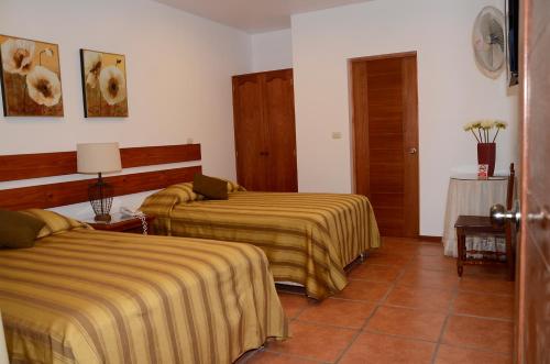 A bed or beds in a room at Oro Viejo