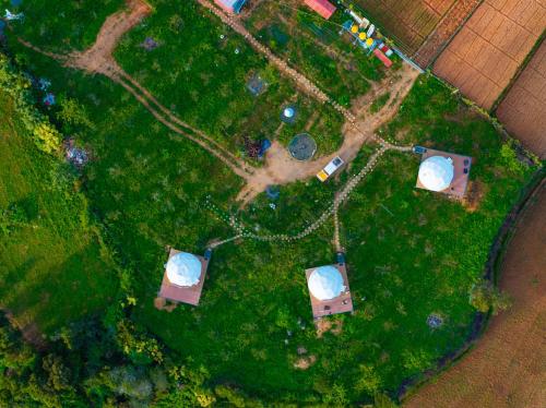 an overhead view of a park with trees and grass at L.T NATURE GLAMPS in Kodaikānāl