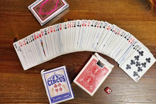 a wooden table with a deck of playing cards at familie in Otsu
