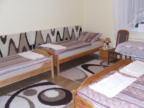 Posteľ alebo postele v izbe v ubytovaní Meggyes Vendégház