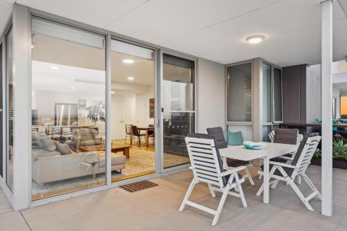 a dining room with a table and chairs at EAST34/60 - Urban Sanctuary in Perth