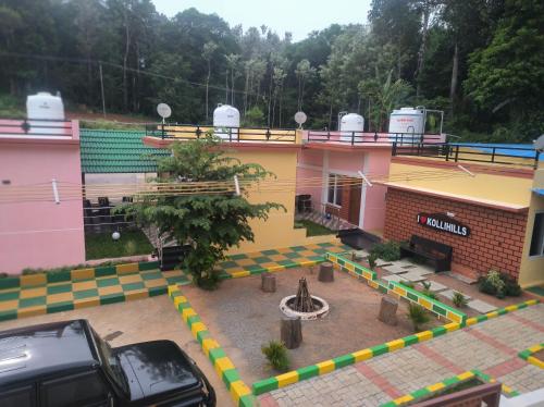 an overhead view of a building with a basketball court at Kanna Garden by Bodhi Bungalows in Kolli Hills