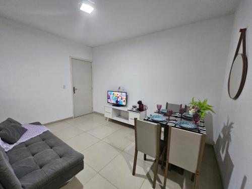 a living room with a couch and a table at Marques Beach House MCZ in Maceió