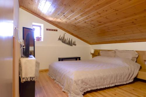 a bedroom with a bed and a tv in a room at Aeneo Studio 2 in Symi