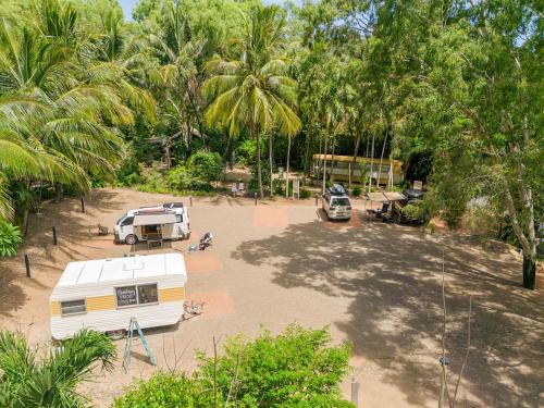 an aerial view of a campground with a caravan and trees at Bounce Magnetic Island and Koala Park - formerly Roamer in Horseshoe Bay