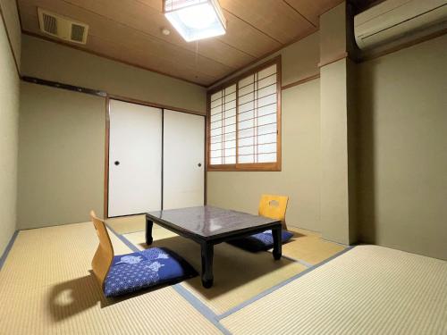 Postel nebo postele na pokoji v ubytování Dochu Land Shin Onsen