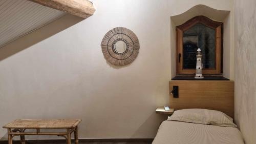 a bedroom with a bed and a mirror on the wall at La Dolce Villa in Rapallo