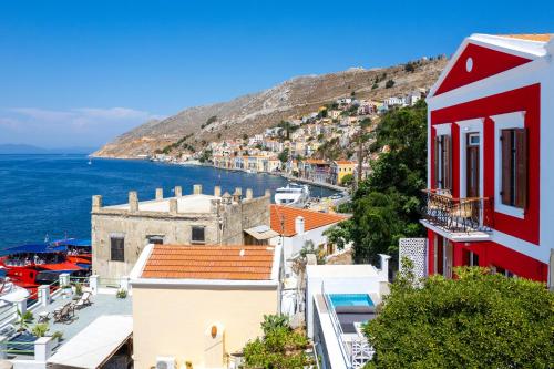 a view of the town of positano and the ocean at Annikas Port View-Ground in Symi