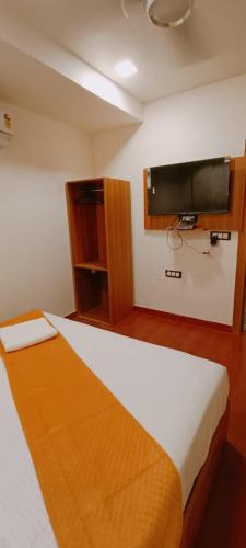 Postel nebo postele na pokoji v ubytování Hotel golden tree