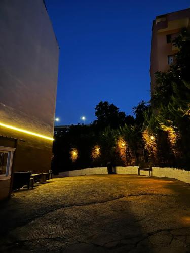 a night view of a park with two benches at Bayrak Suit Home Trabzon in Pelitli