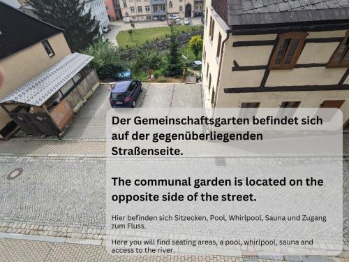a sign that reads the command garden on the opposite side of the street at HW2B - Urlaubsmagie - Wohlfühlwohnung mit Balkon, Pool, Sauna & Terrasse in Sebnitz