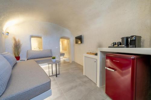 a kitchen and living room with a red refrigerator at Alaya Suites in Pirgos