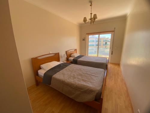 Ένα ή περισσότερα κρεβάτια σε δωμάτιο στο Two bedroom apartment with pool