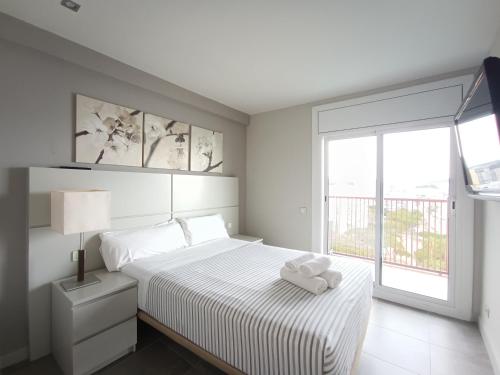 Posteľ alebo postele v izbe v ubytovaní Aiguaneu Apartaments Els Pins
