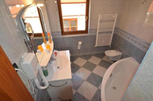 a bathroom with a sink and a toilet at Apartments Ana Wellness S in Rovinj