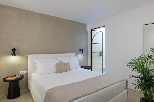 Postel nebo postele na pokoji v ubytování Eolia Luxury Villas