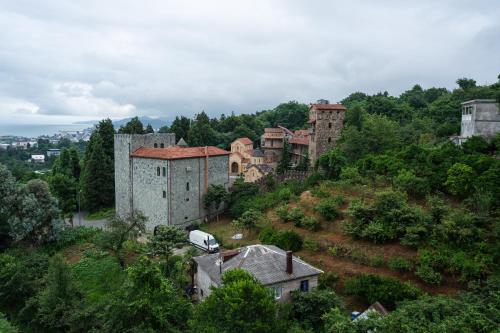 an old building on top of a hill at Feriatale - Cabins near Batumi in P'eria
