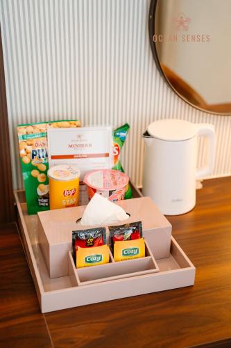a box of food sitting on top of a table at Ocean Senses Hotel in Ðông Thôn