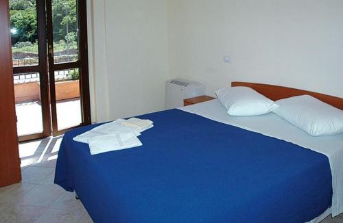 Hotel Ristorante Umbria Valnerina tesisinde bir odada yatak veya yataklar